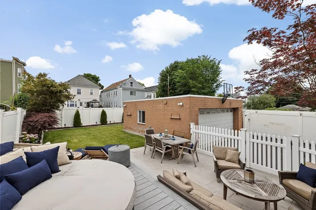 a view of a patio and a yard
