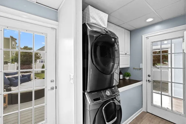 a view of a storage and utility room with washer and dryer