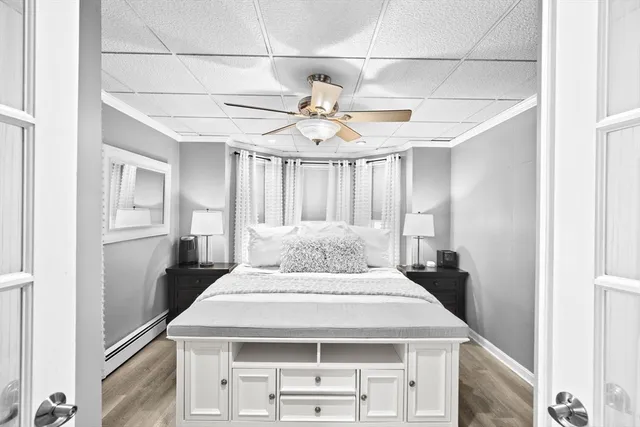 a kitchen with a stove a refrigerator and chandelier