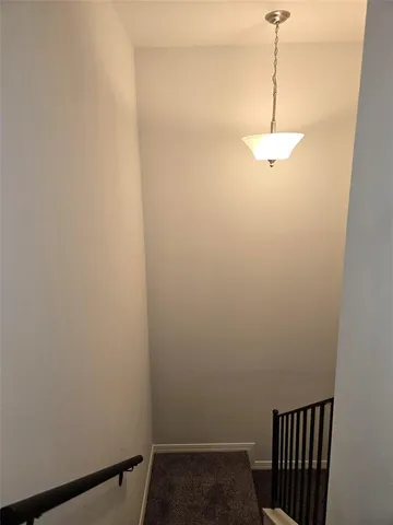 a view of a hallway with a window