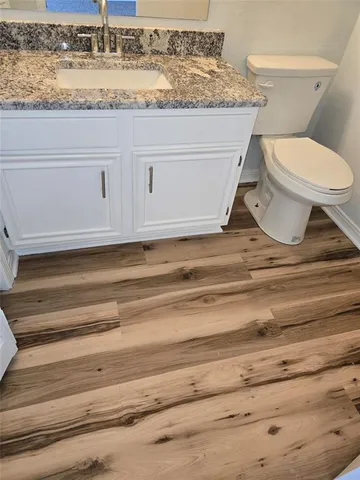 a bathroom with a toilet and a sink