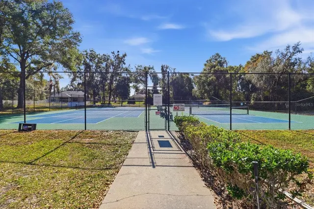 a bathroom with a sink mirror and vanity