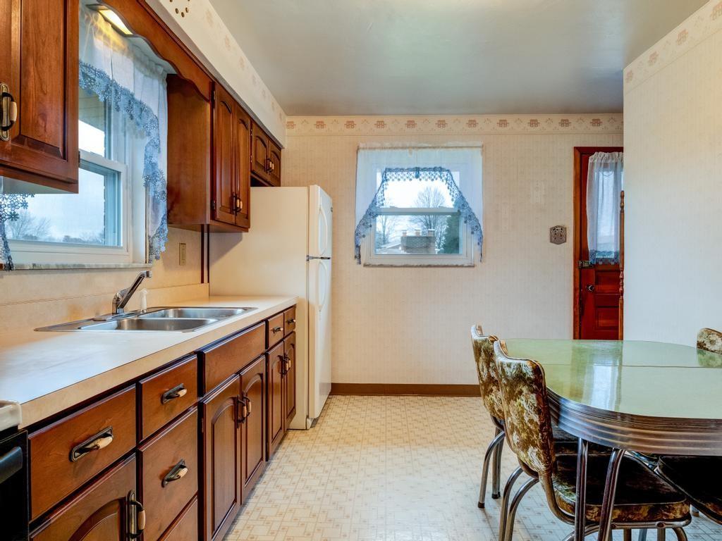 129 Wall Street Rochester, PA 15074 - Photo 2 of 24 a kitchen that has a cabinets and a stove