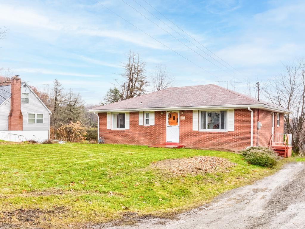 129 Wall Street Rochester, PA 15074 - Photo 22 of 24 a front view of a house with a yard