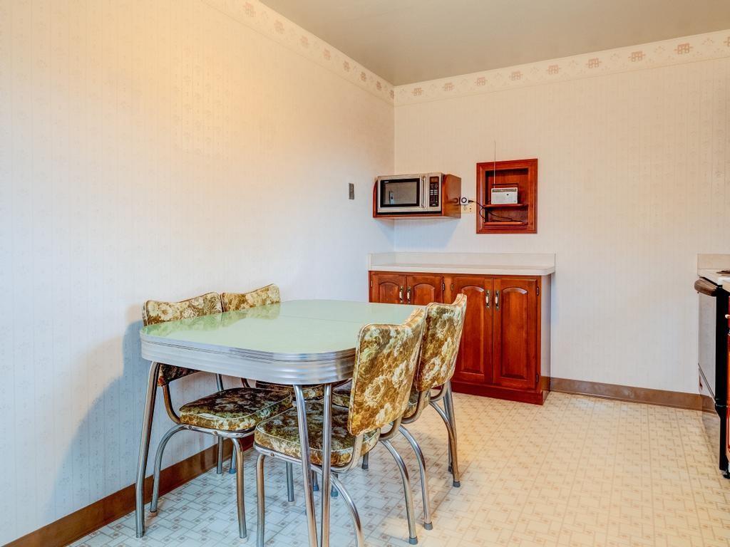 129 Wall Street Rochester, PA 15074 - Photo 4 of 24 a dining room with furniture and wooden floor