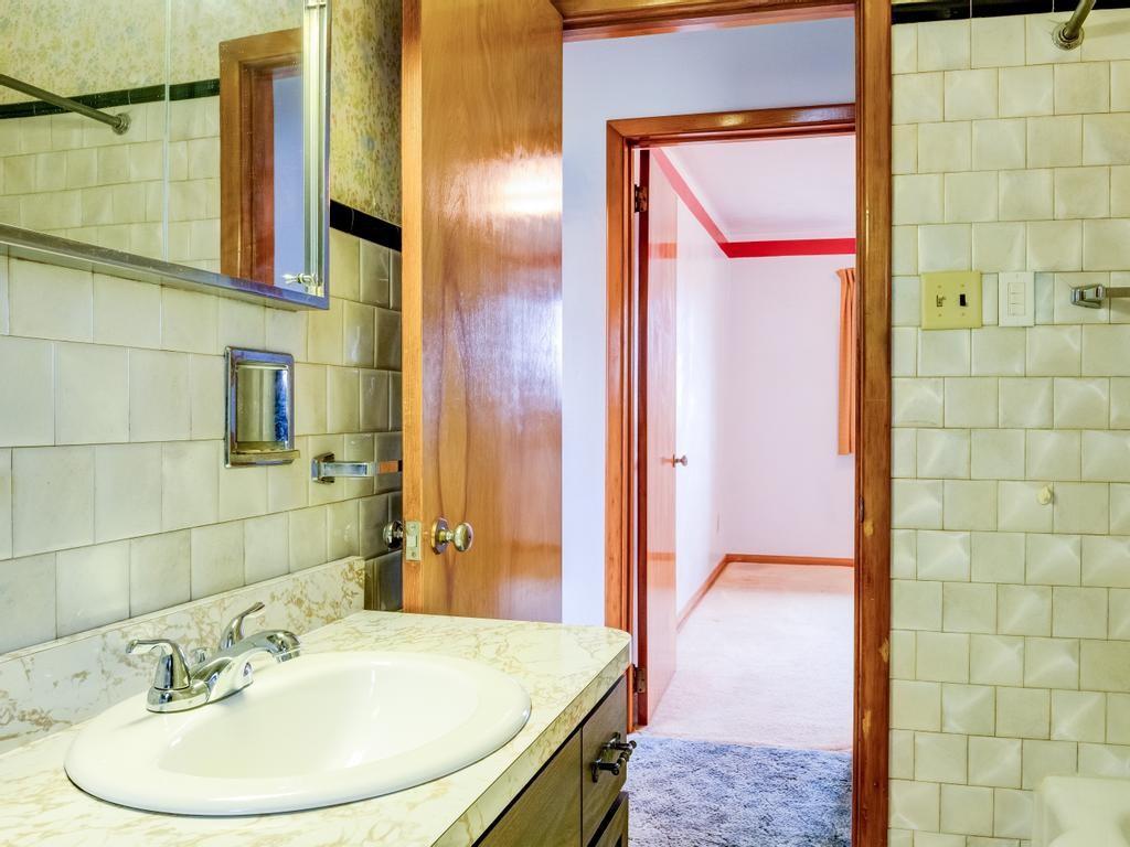 129 Wall Street Rochester, PA 15074 - Photo 9 of 24 a bathroom with a sink and a mirror