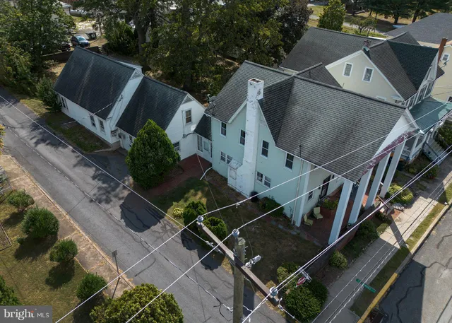 a bathroom with a toilet a sink and a mirror