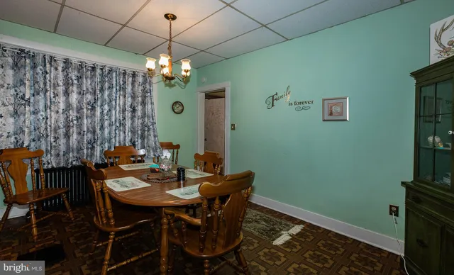 a bedroom with a bed and a dresser in it