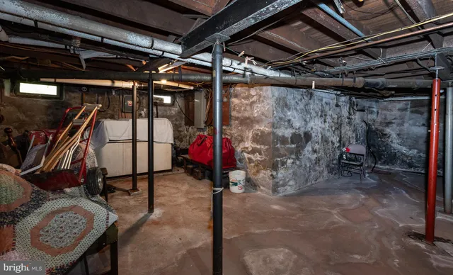 a white toilet sitting next to a shower curtain