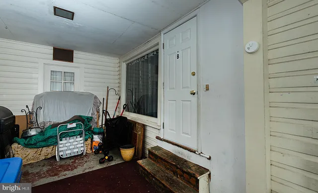 a bedroom with bed and a window
