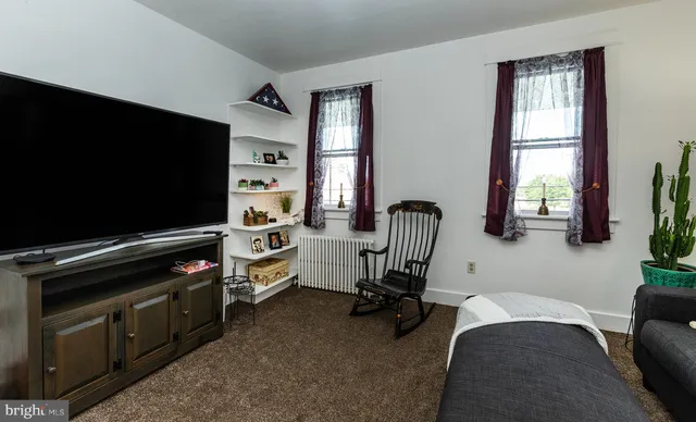 a room with furniture and a large window