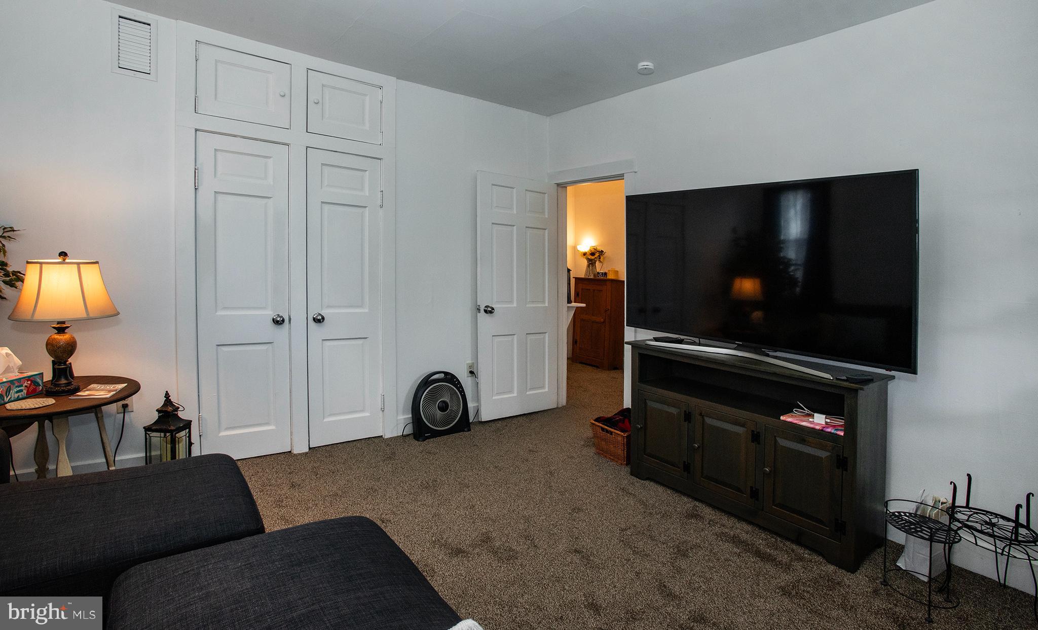100 West Broad Street Elizabethville, PA 17023 - Photo 49 of 89 a living room with furniture and a flat screen tv