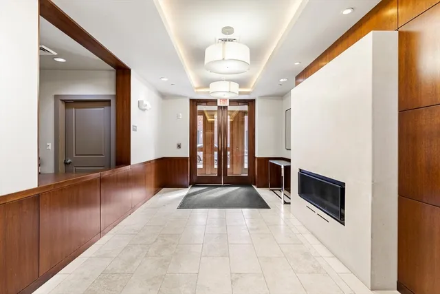 a lobby with furniture and window