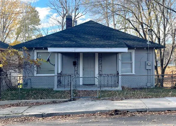 a view of a house with a street