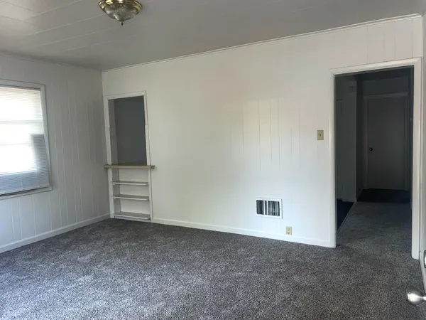 a view of a room with wooden walls