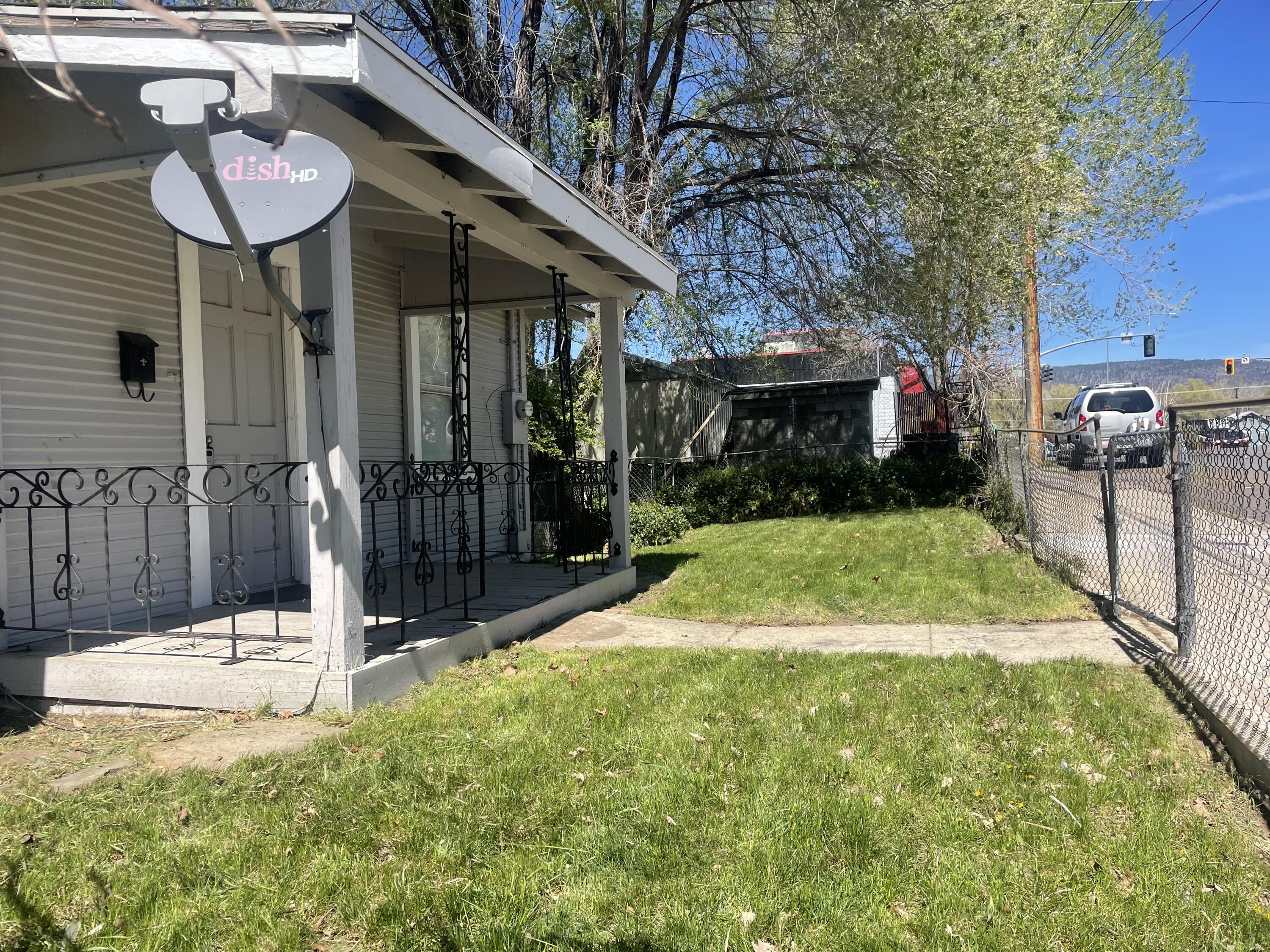 40 Foss Street Susanville, CA 96130 - Photo 7 of 45 a view of a backyard with table and chairs potted plants and a large tree