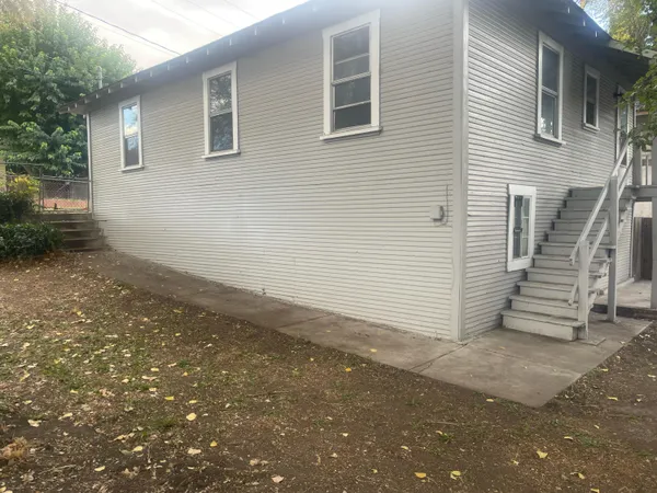 a view of a house with a street