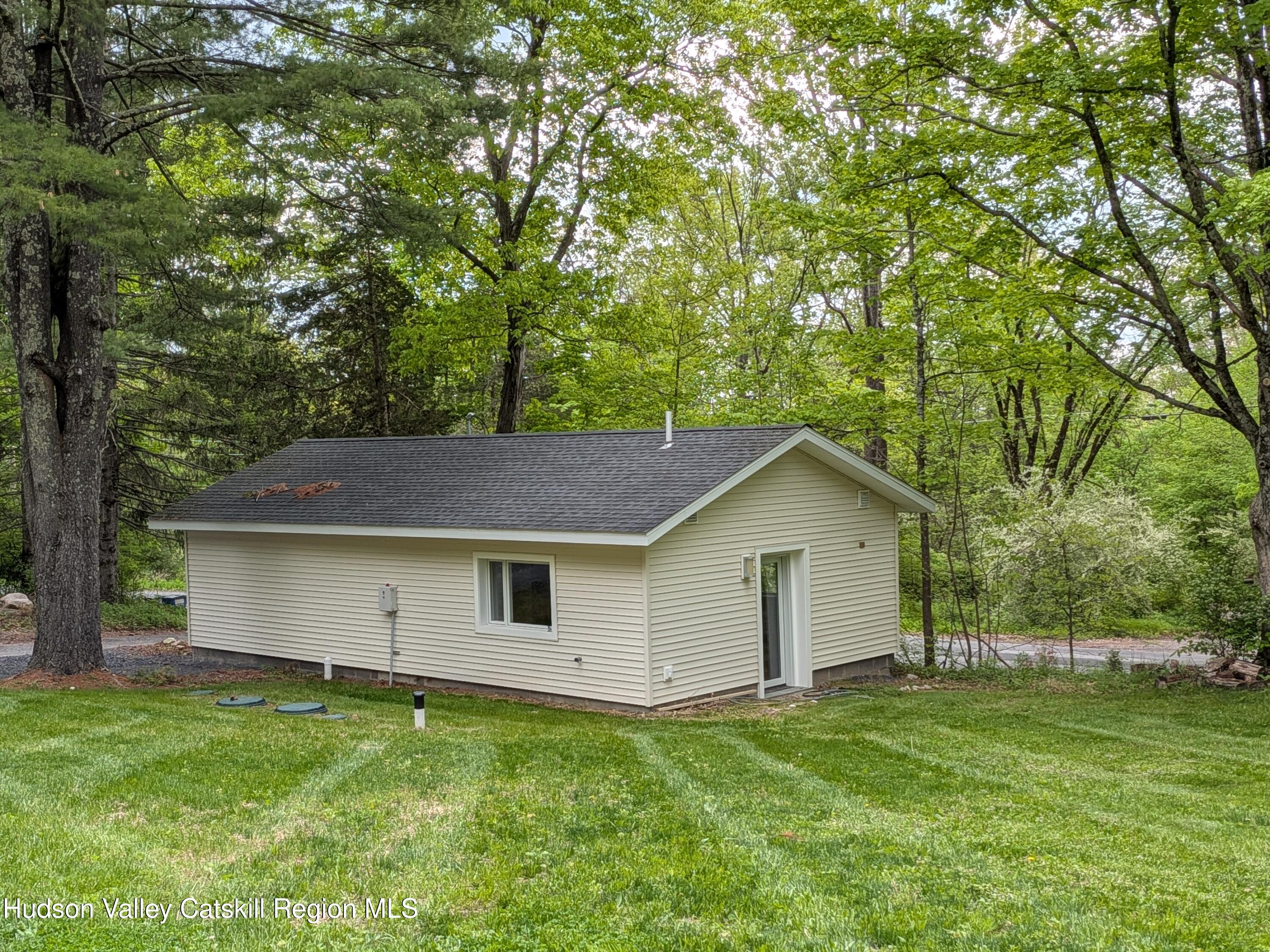 513 South Mountain Road Gardiner, NY 12525 - Photo 42 of 63 a front view of a house with a garden
