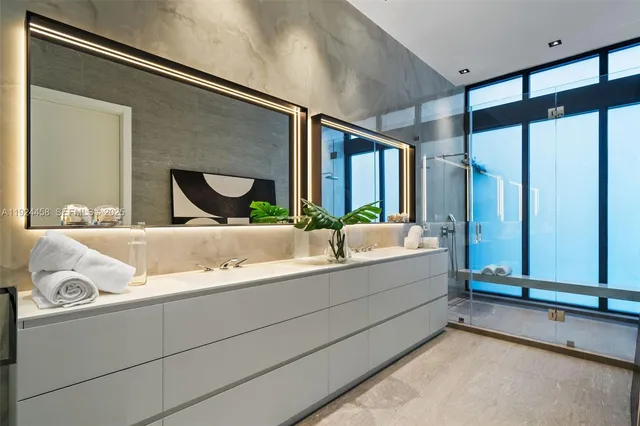 a kitchen with stainless steel appliances kitchen island granite countertop a sink and cabinets