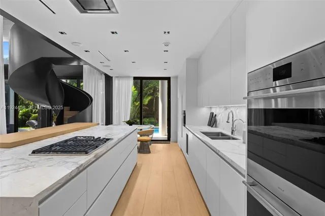 a living room with fireplace furniture and a large window