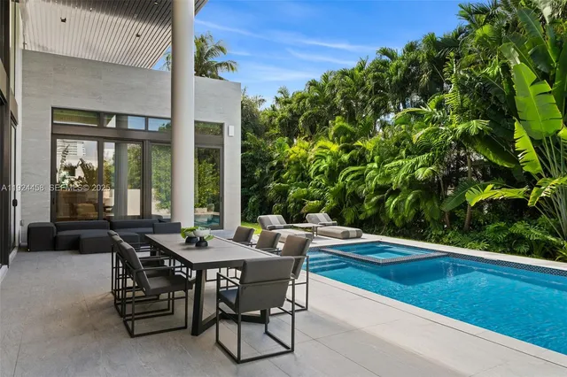 a patio with table and chairs