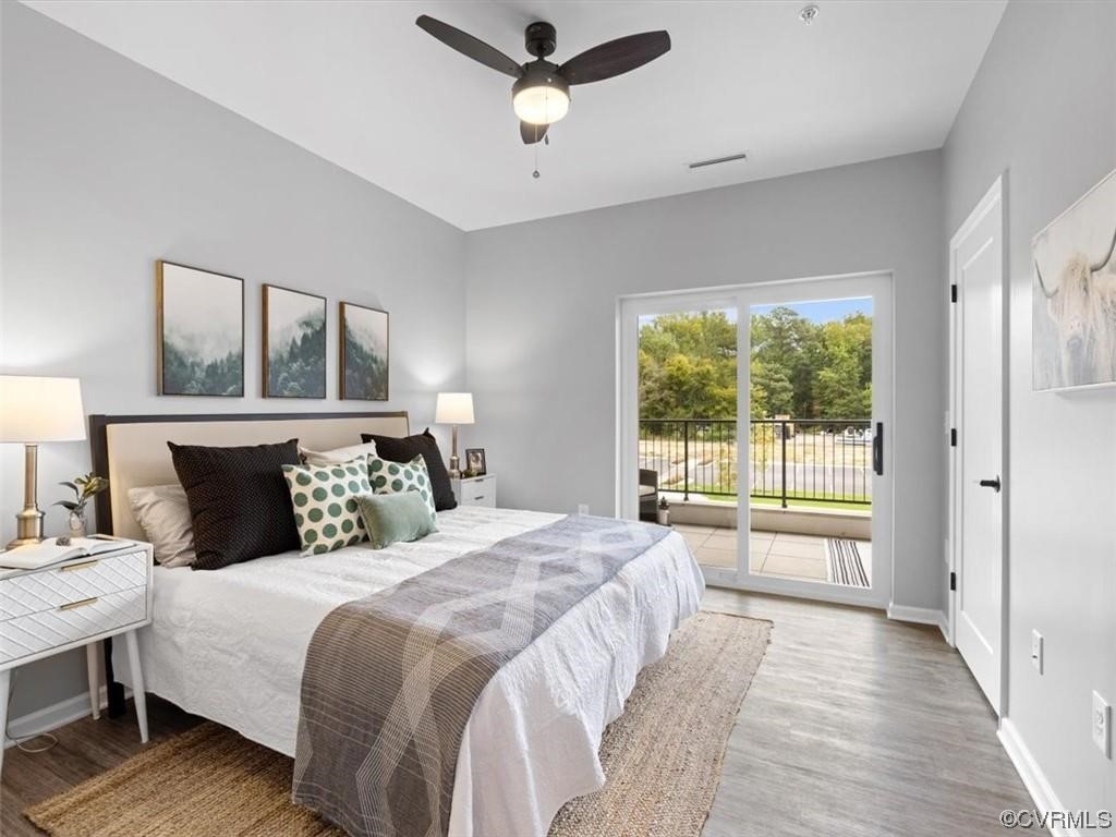 1504 Ewing Park Loop, Unit 207 Midlothian, VA 23113 - Photo 14 of 26 a bedroom with a large bed and a large window