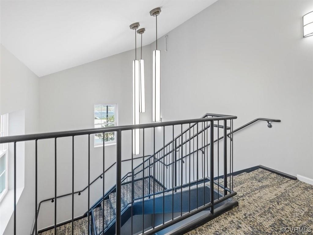 1504 Ewing Park Loop, Unit 207 Midlothian, VA 23113 - Photo 21 of 26 a view of staircase with wooden floor and a window
