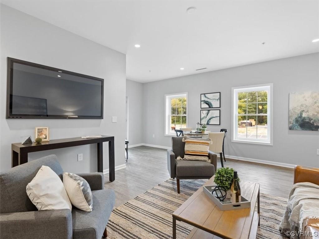 1504 Ewing Park Loop, Unit 207 Midlothian, VA 23113 - Photo 8 of 26 a living room with furniture and a flat screen tv