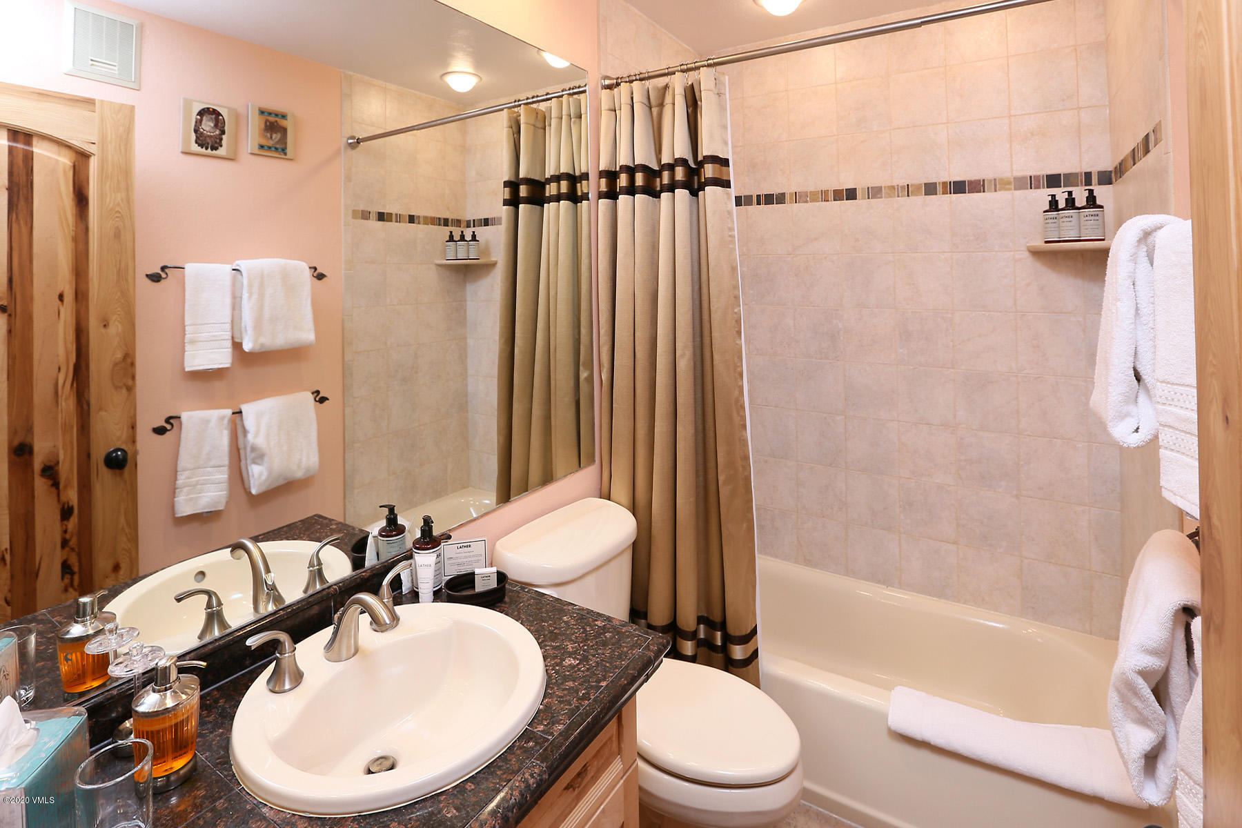 137 Benchmark Road, Unit 520 Avon, CO 81620 - Photo 16 of 22 a bathroom with a sink toilet and shower