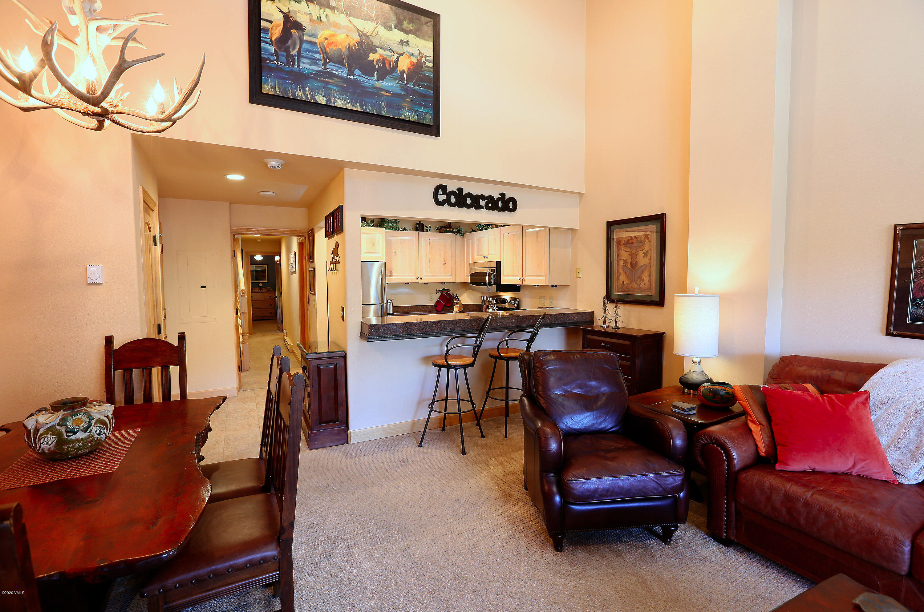 137 Benchmark Road, Unit 520 Avon, CO 81620 - Photo 2 of 22 a living room with furniture and a flat screen tv