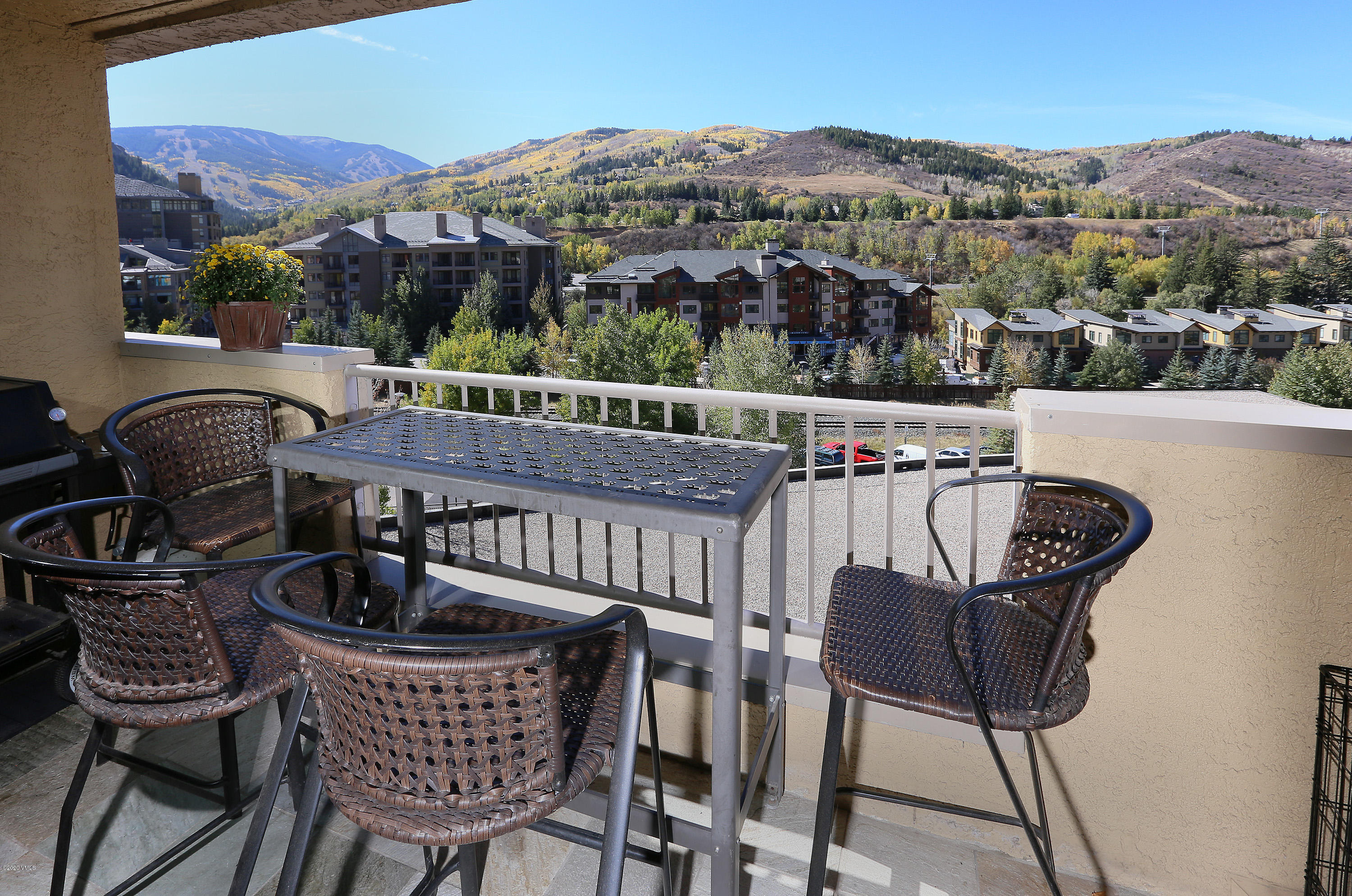 137 Benchmark Road, Unit 520 Avon, CO 81620 - Photo 9 of 22 a view of a chairs and table in patio