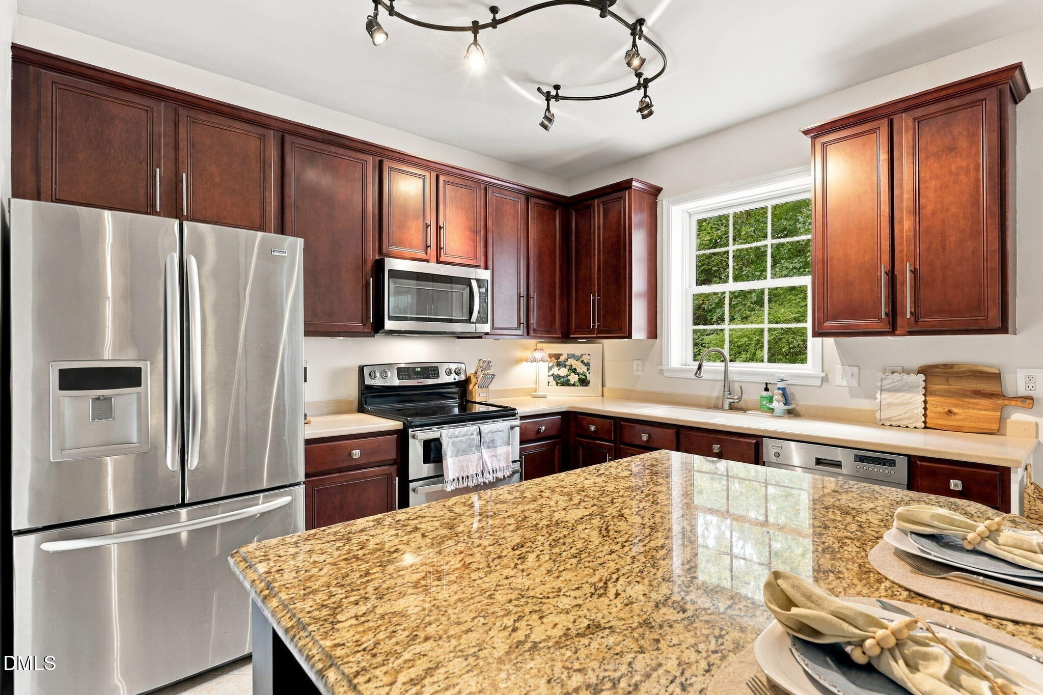 6 Sydenham Road Durham, NC 27713 - Photo 10 of 44 Kitchen featuring wood cabinetry and stainless steel appliances.