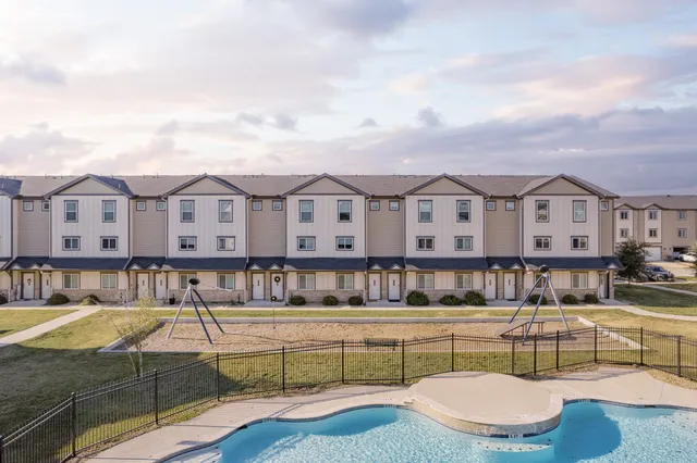 a view of a swimming pool with a patio