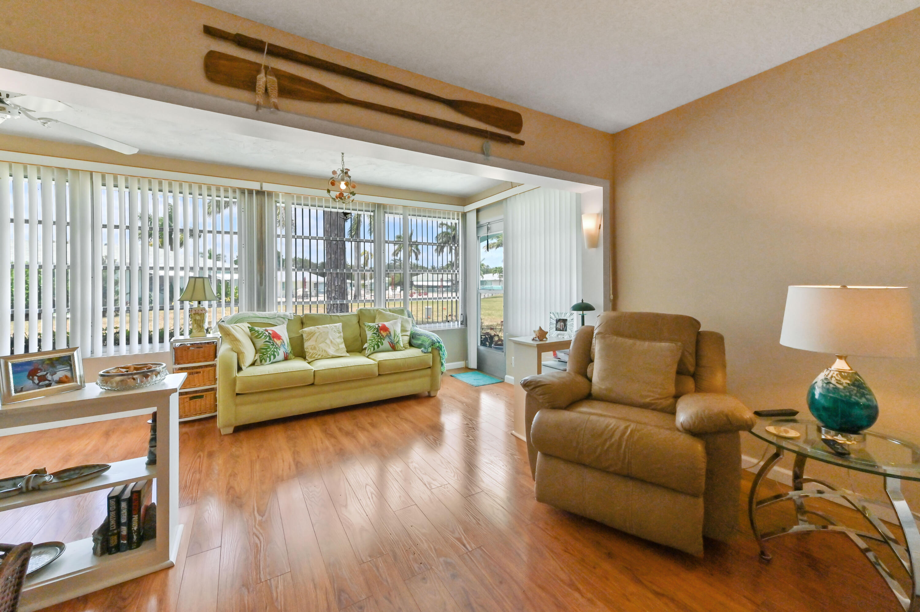 604 Hummingbird Lane Delray Beach, FL 33445 - Photo 19 of 32 a living room with furniture and a large window