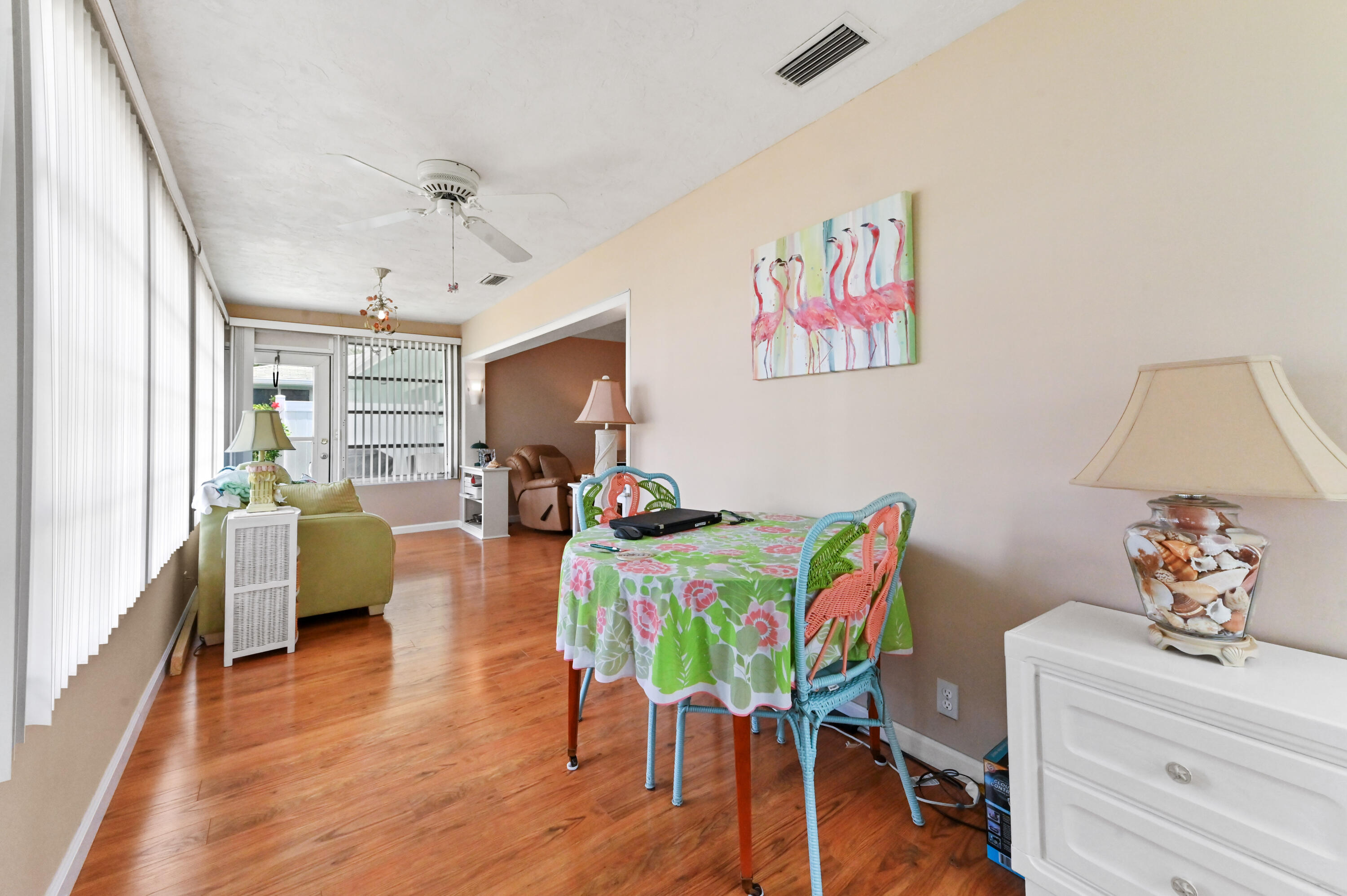 604 Hummingbird Lane Delray Beach, FL 33445 - Photo 21 of 32 a living room with furniture and a wooden floor