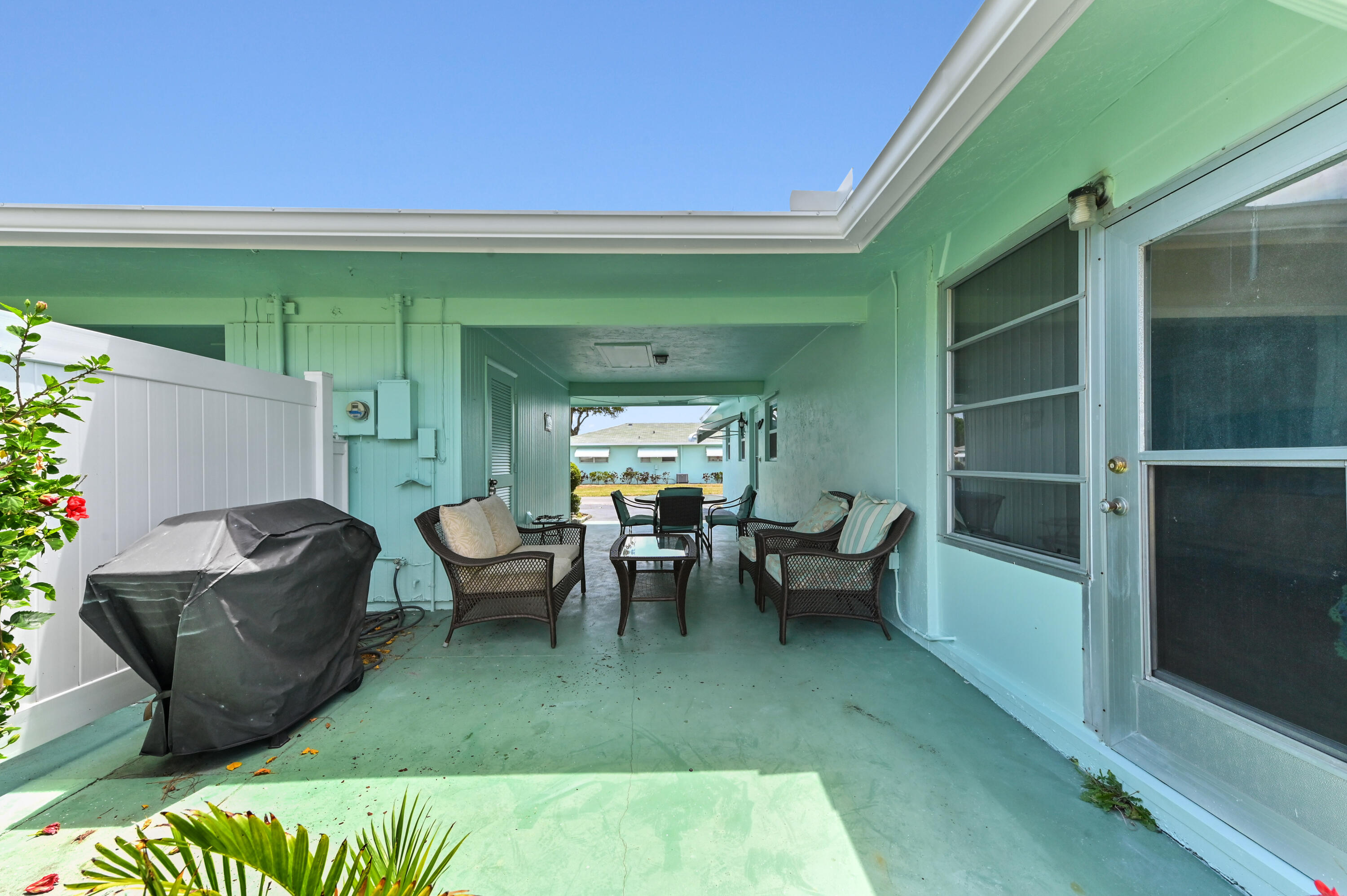 604 Hummingbird Lane Delray Beach, FL 33445 - Photo 25 of 32 a living room with furniture and a window