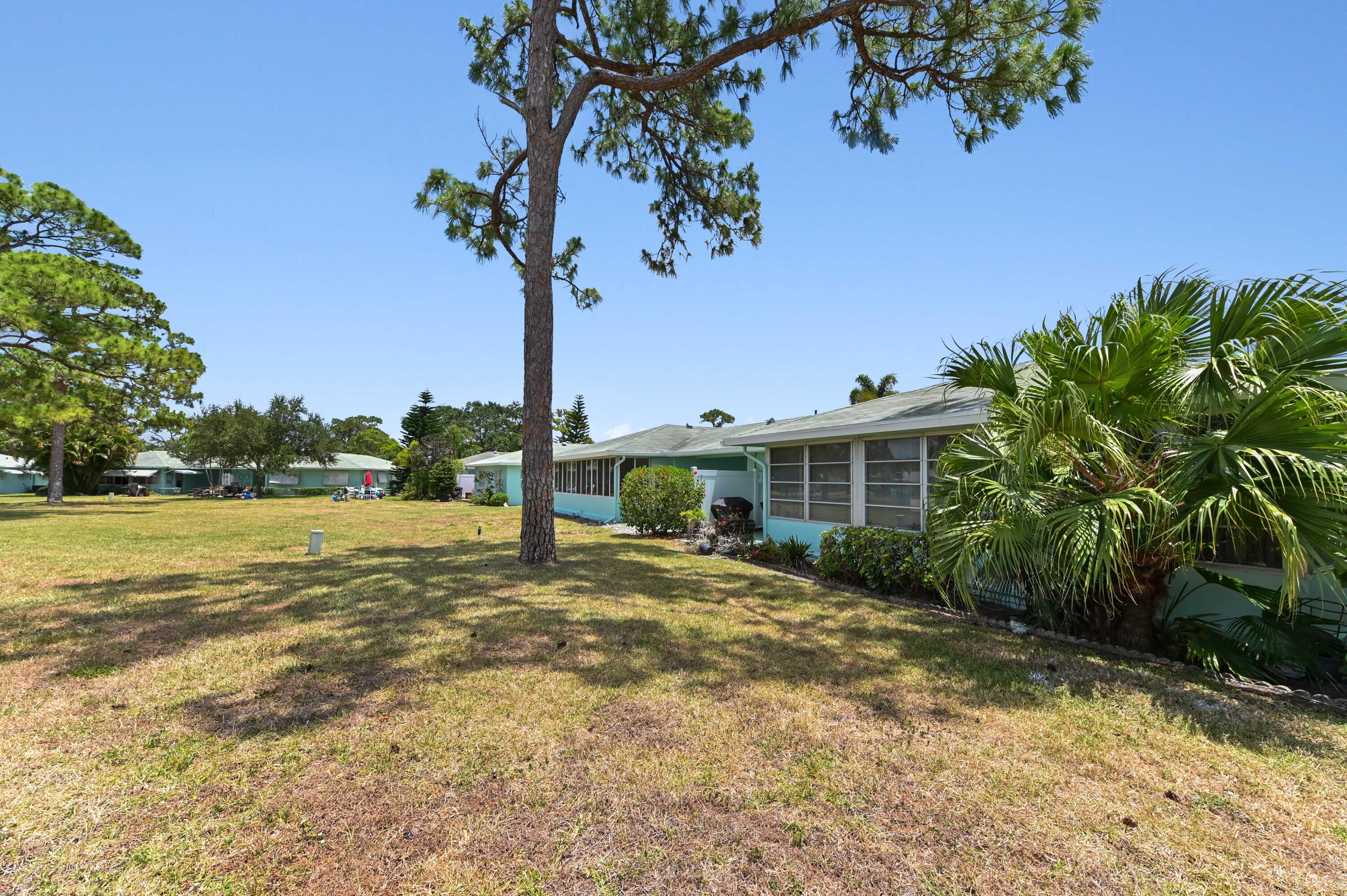 604 Hummingbird Lane Delray Beach, FL 33445 - Photo 27 of 32 a front view of a house with garden