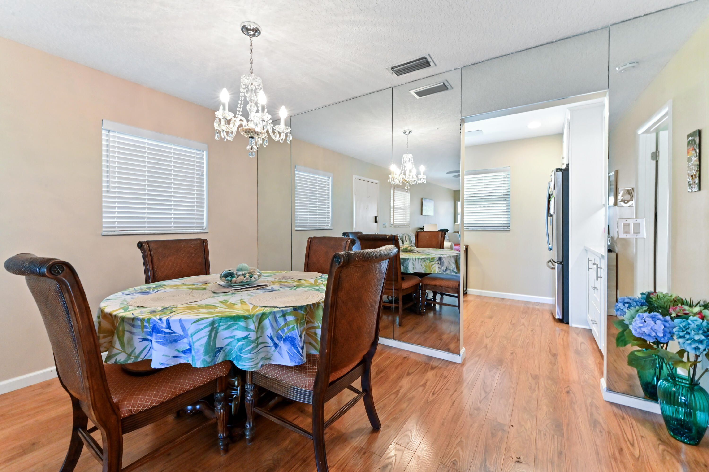 604 Hummingbird Lane Delray Beach, FL 33445 - Photo 8 of 32 a view of a dining room with furniture and wooden floor