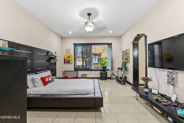 a living room with furniture gym equipment and a window