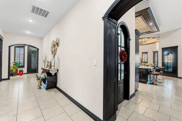 a living room with furniture gym equipment and a fireplace