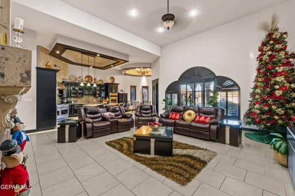 a living room with furniture and a fireplace