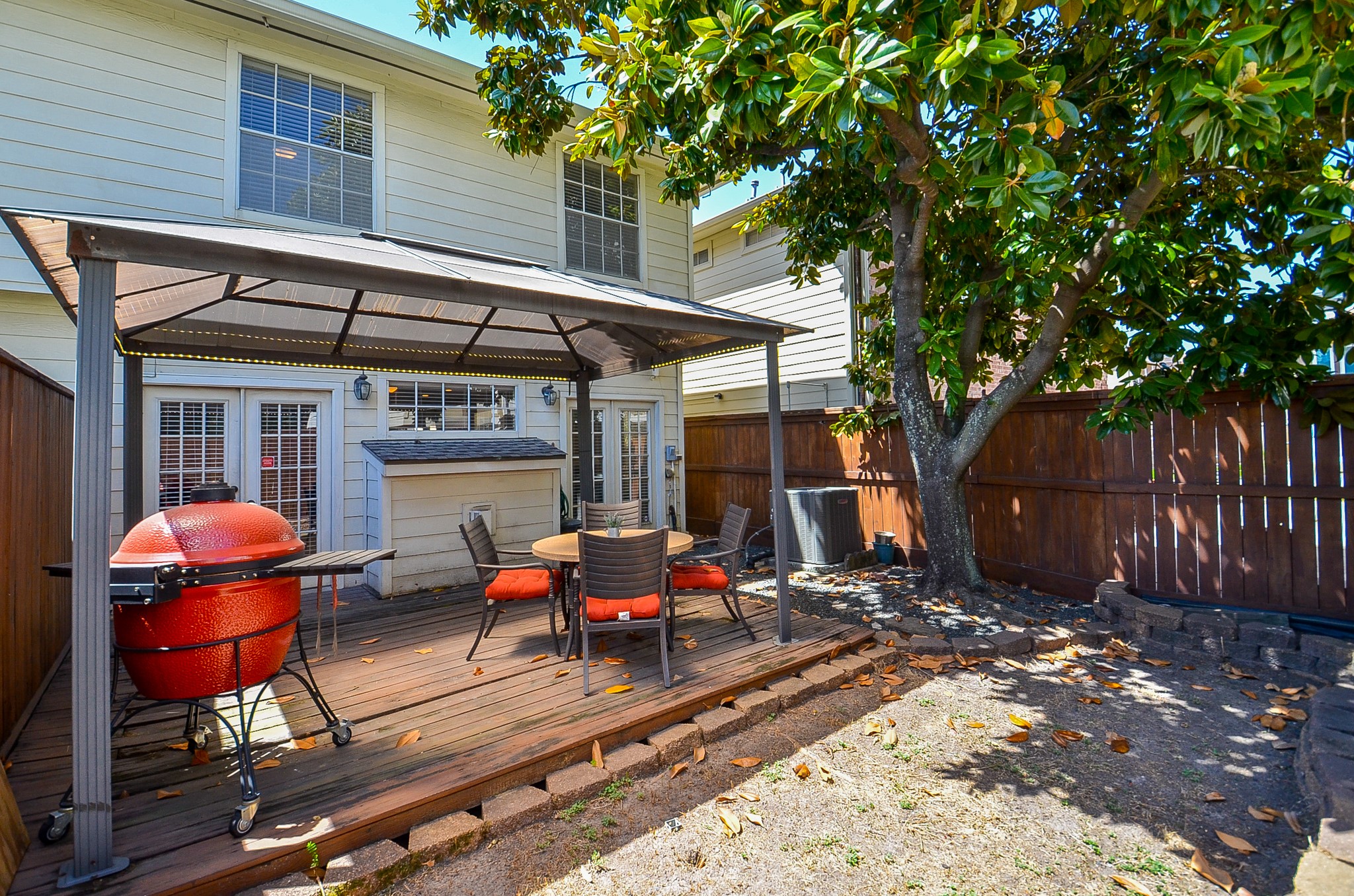 4916 Inker Street Houston, TX 77007 - Photo 14 of 36 A covered deck, and a magnolia tree providing shade!