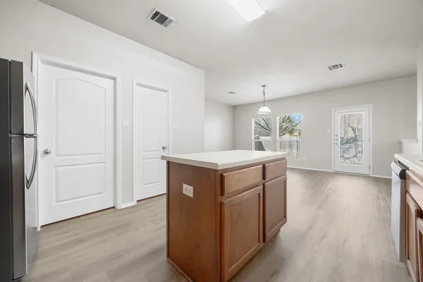 a kitchen with sink and cabinets