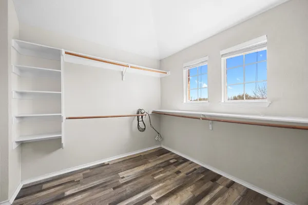 a view of a room with racks on the wall