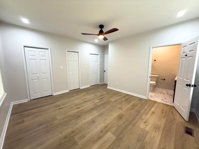 a kitchen with kitchen island a stove and a sink