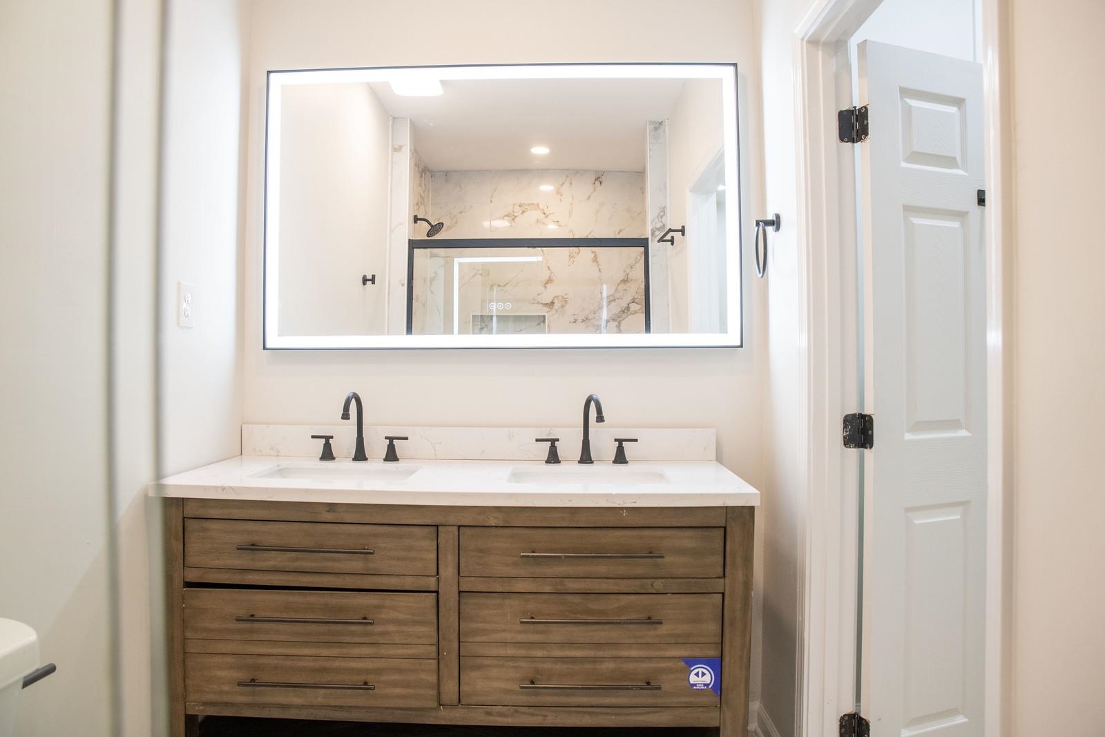 4103 Orleans Road Memphis, TN 38116 - Photo 11 of 32 a bathroom with a sink vanity and a mirror