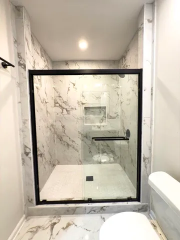 a bathroom with a sink vanity and a mirror