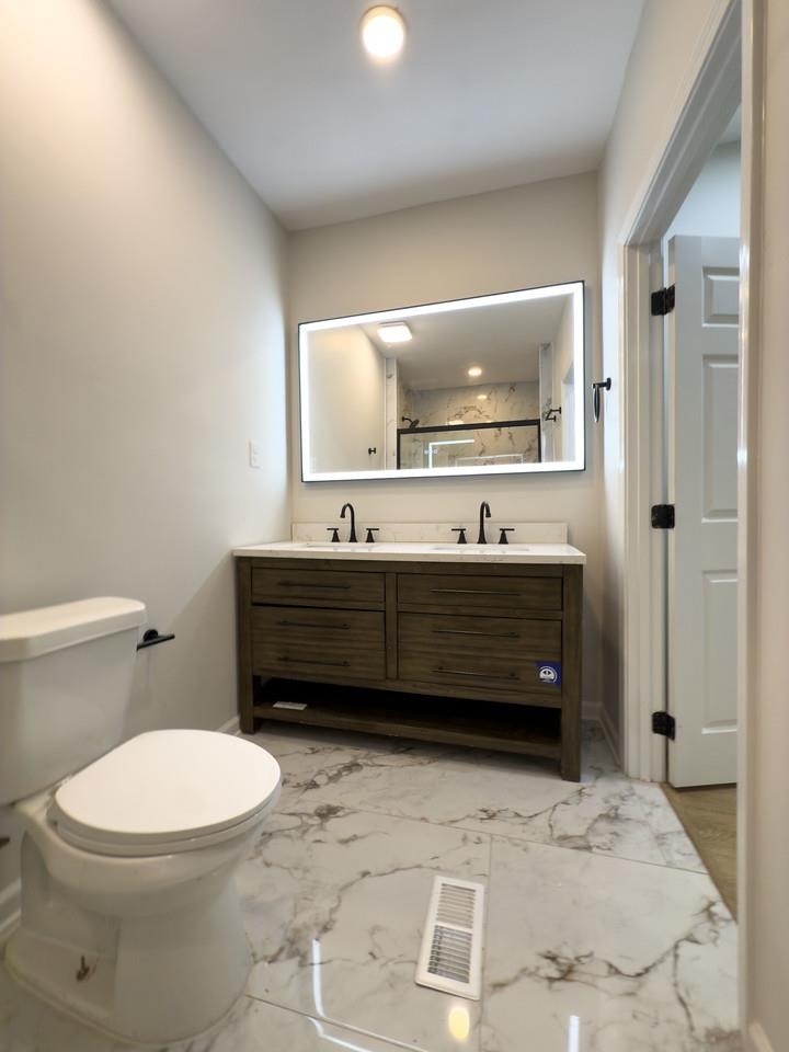 4103 Orleans Road Memphis, TN 38116 - Photo 15 of 32 a bathroom with a sink a toilet and mirror