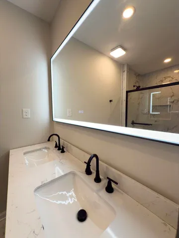 a bathroom with a shower and toilet