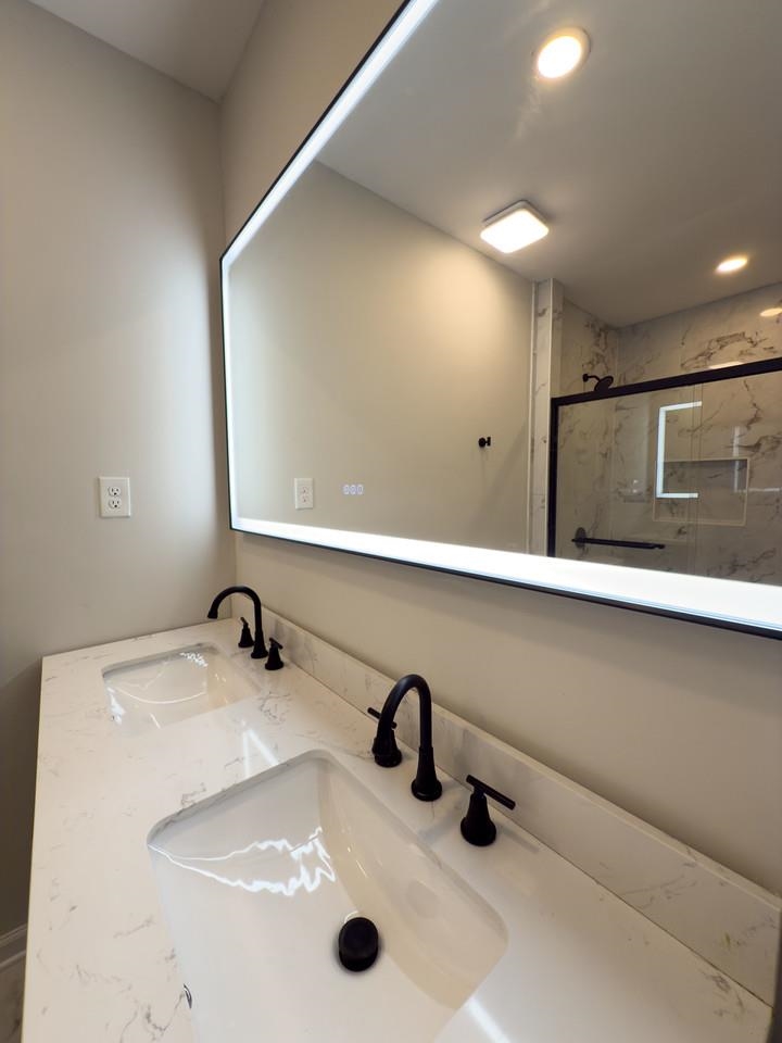 4103 Orleans Road Memphis, TN 38116 - Photo 16 of 32 a bathroom with a sink and a mirror